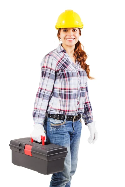 Молодий усміхнений працівник у шоломі тримає коробку інструментів — стокове фото