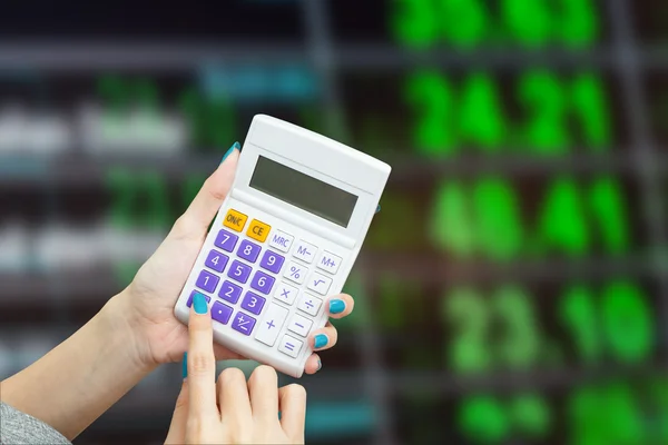 Hand holding calculator with blur background of  exchange rate b — Stock Photo, Image