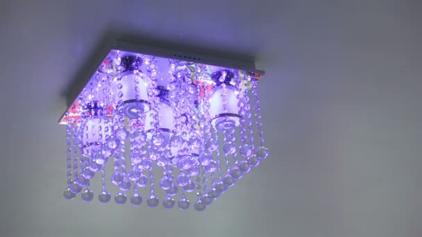 Crystal chandelier ceiling light turn on and off — Stock Video