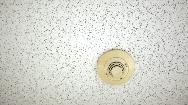 Smoke detector with red alert activated on ceiling — Stock Video