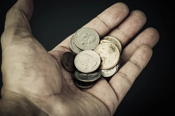 Hand and group of US American coins — Stock Photo, Image