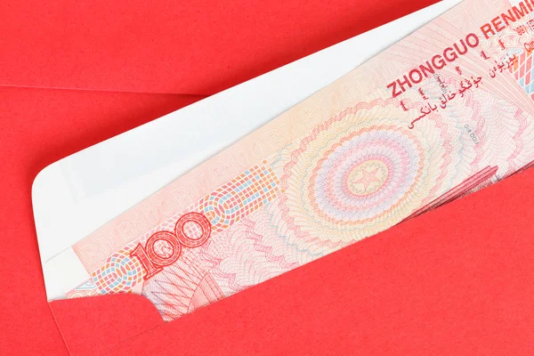 Chinese or 100 Yuan banknotes money in red envelope, as chinese — Stock Photo, Image