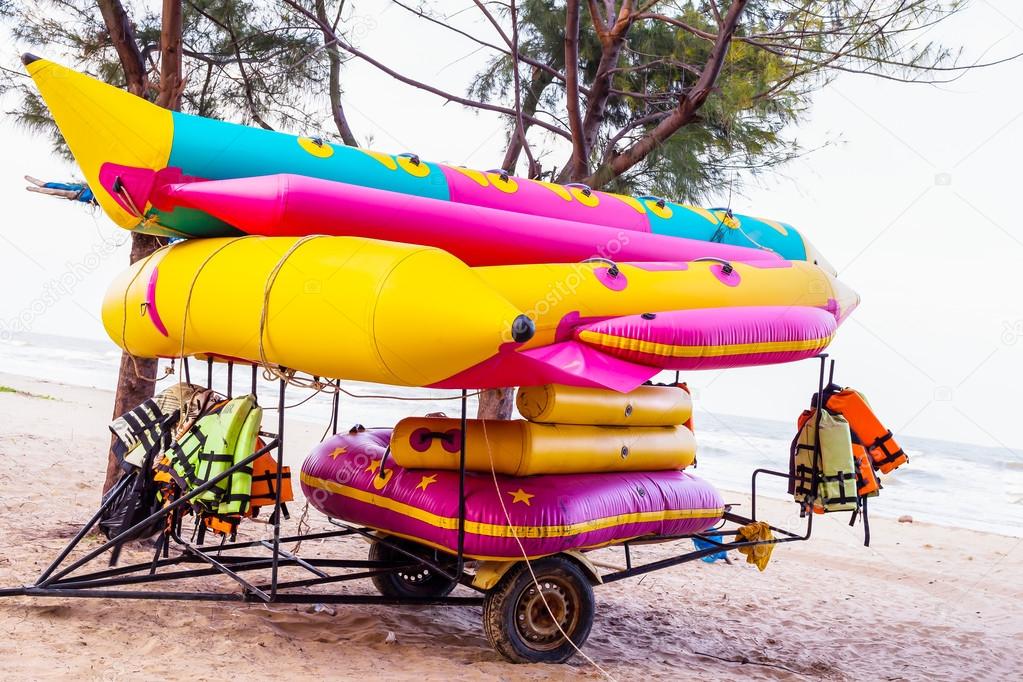 colorful banana boat lays on a beach