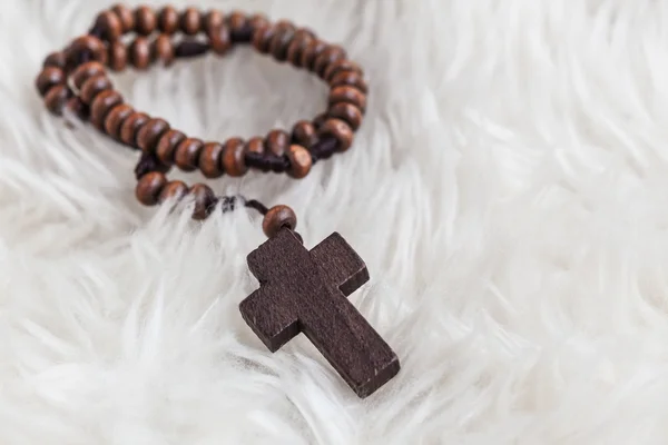 Christian cross necklace on sheep wool, Jesus religion concept a — Stock Photo, Image