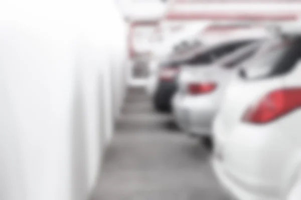 Abstract oskärpa bakgrund av baksidan av bilen på parkeringen w — Stockfoto