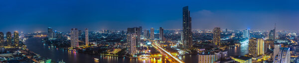 Business Building Bangkok city area at night life with transportation car and ship as panorama, high angle bird eyes view
