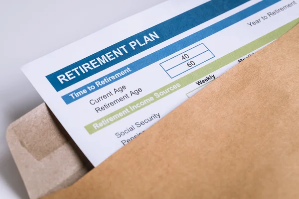 Retirement Planning letter in brown envelope opening, business c — Stock Photo, Image