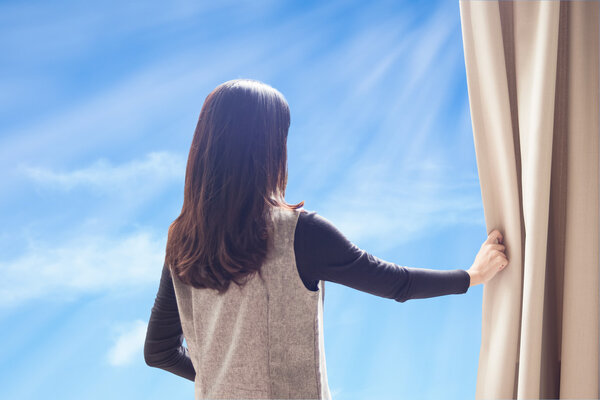 Asian portrait beautiful woman opening curtains and cloud blue s