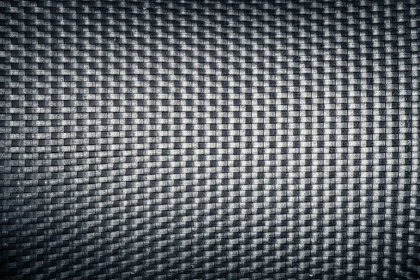 Műanyag szőtt fonott mintás, fekete színű háttér textúra — Stock Fotó