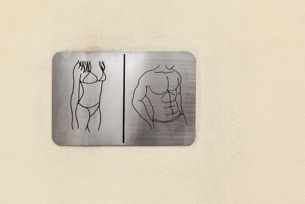 男性と女性のシンボルがトイレや壁にトイレの標識します。 — ストック写真