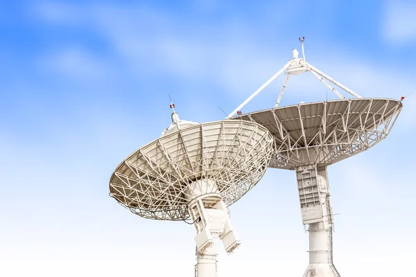 Satellite dish antenna radar big size isolated on blue sky backg — Stock Photo, Image