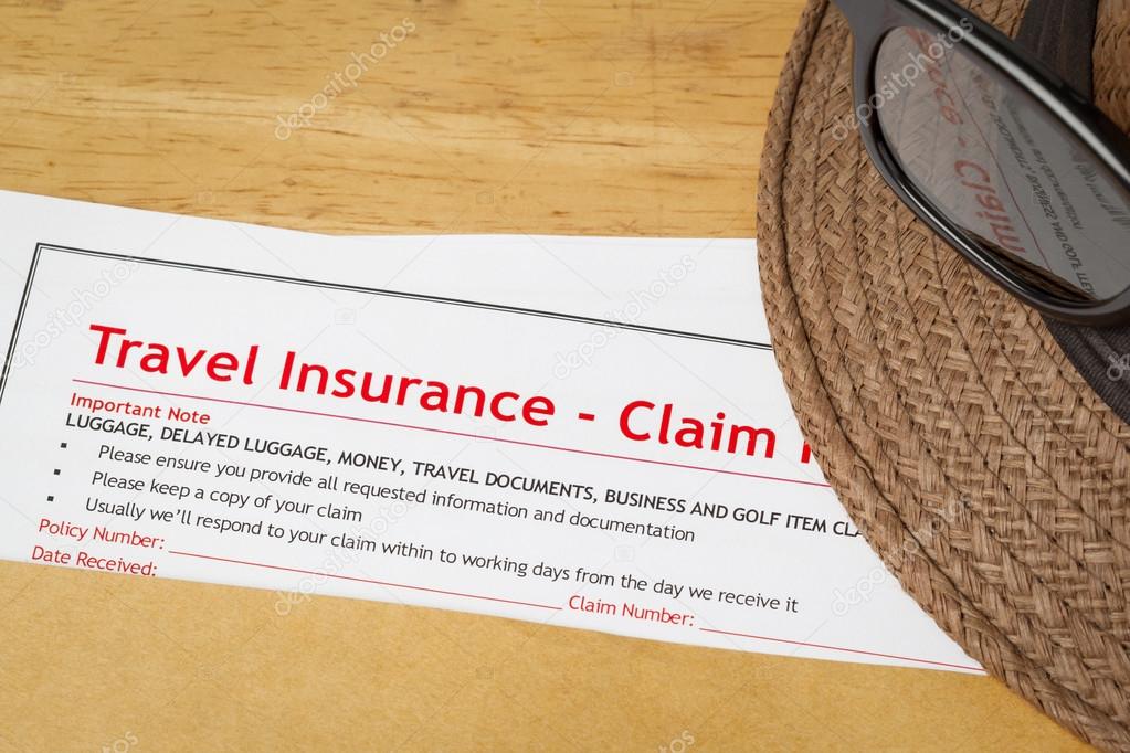 Travel Insurance Claim application form and hat with eyeglass on