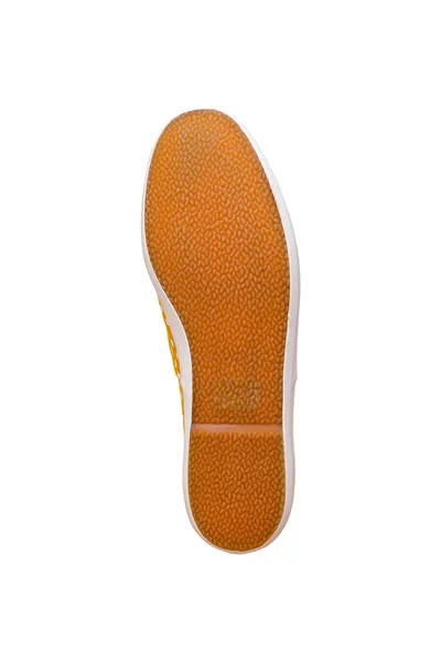 Suela de goma de una zapatilla de deporte de hombre sobre fondo blanco —  Fotos de Stock