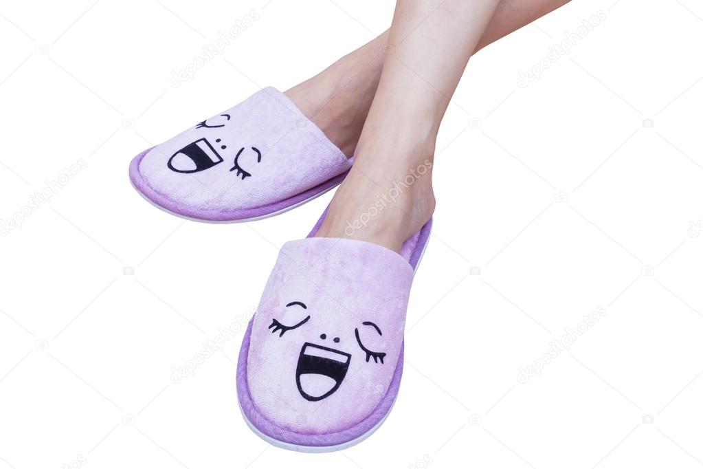 woman feet with smile slippers and happy, close up view, on whit