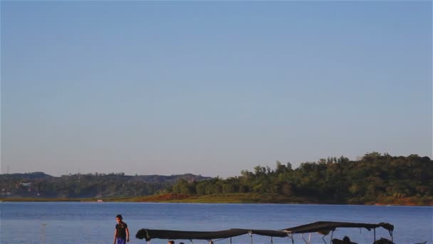 SANGKHLABURI, THAILAND - DECEMBER 27, 2015: View of service boat, and passenger heading to underwater city, Wat Wang Wiwekaram Kao, Sangkhlaburi District, Kanchanaburi Thailand,on December 27, 2015 — Stock Video