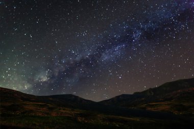 Milky Way Galaxy over mountain at Khao Kho National Park, Phetch clipart