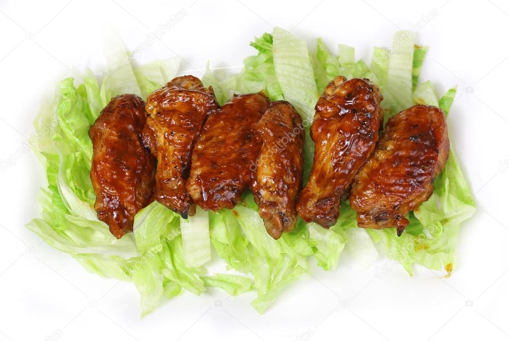 chicken wings on a bed of lettuce