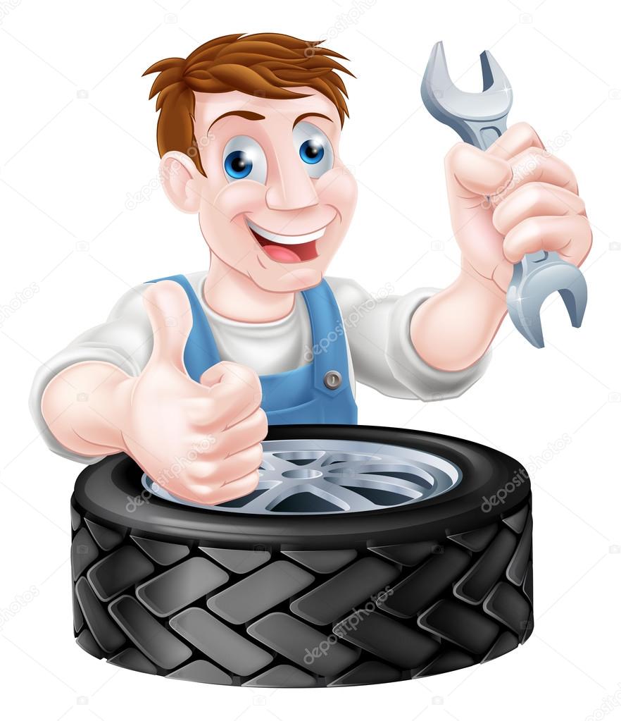 Mechanic holding spanner and giving a thumbs up behind a tyre