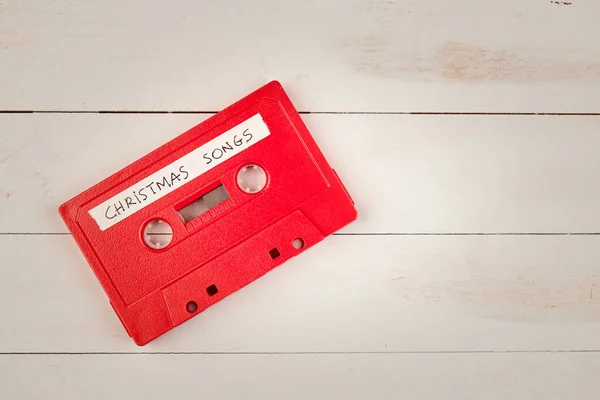 Audio Cassette Tape Met Kerstliedjes Een Witte Houten Achtergrond — Stockfoto