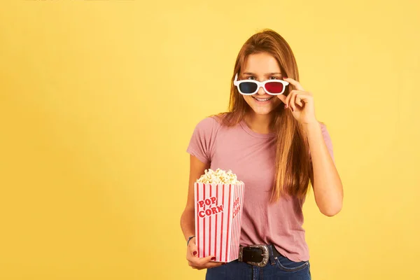 Portrait Beautiful Woman Eating Popcorn Wearing Glasses Yellow Background — Stock Photo, Image