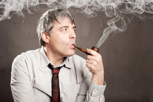 Middle aged man with a pipe — Stock Photo, Image