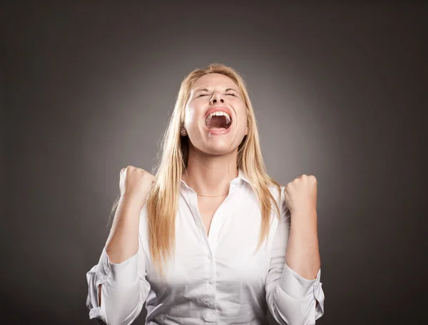 Young man celebrating being a winner — Stock Photo, Image