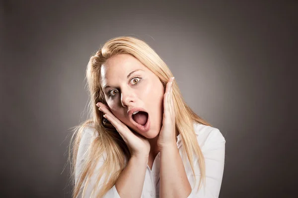 Young woman with surprise expression — Stock Photo, Image