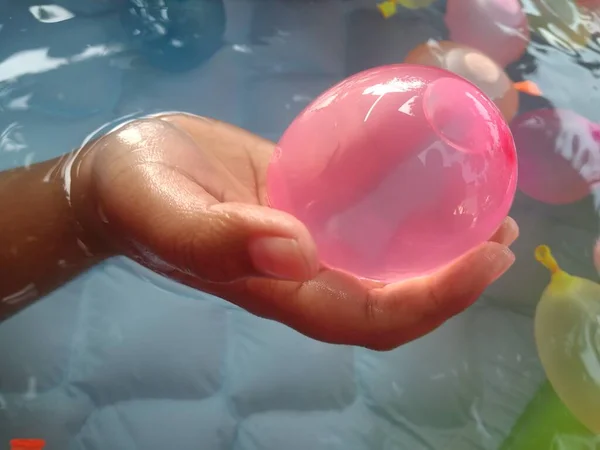Playing with water balloons is a special pleasure and joy for small children who are starting to be active in their activities