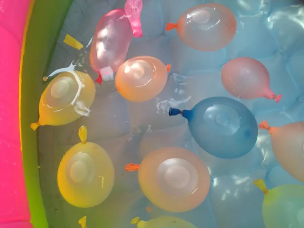 Rainbow Water Balloons Make Your Children Water Pool More Interesting — Stock Photo, Image