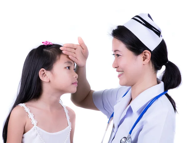 Gelukkig meisje op de verpleegster voor een checkup - onderzocht — Stockfoto