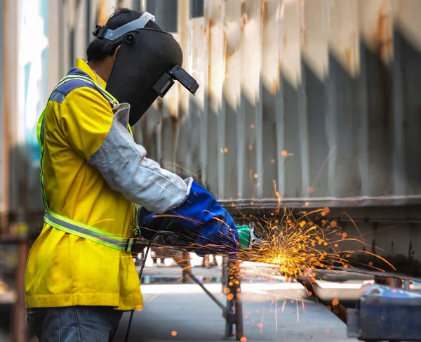 Electric wheel grinding on steel structure — Stock Photo, Image