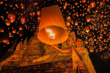 Thai people floating lamp in Ayuthaya historical park clipart
