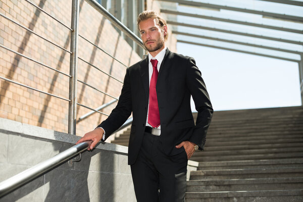 businessman walking down stairs