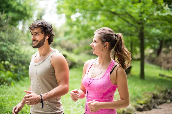 Couple running in park — Stock Photo, Image