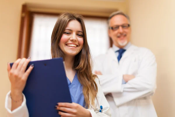 Smiling doctors in hospital — Stock Photo, Image