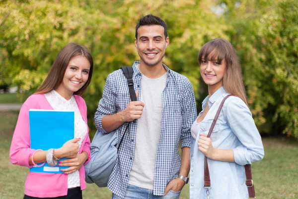 Smiling students outdoor — Stock Photo, Image