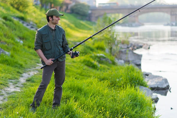 Fisherman fishing on river — Stock Photo, Image