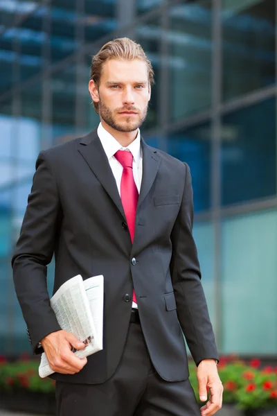 Businessman holding newspaper — Stock Photo, Image