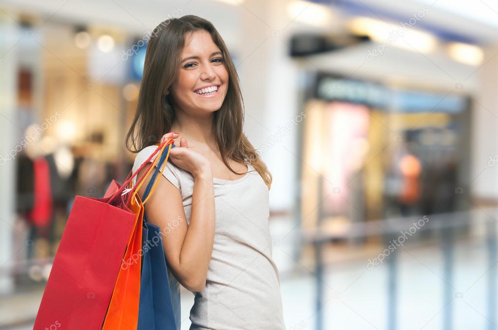 woman holding shopping bags