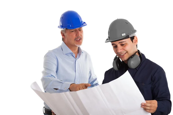 Engineer explaining drawing to worker — Stock Photo, Image
