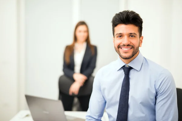 Smiling businessman in his office — Stock Photo, Image