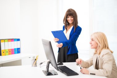 Smiling woman working together clipart