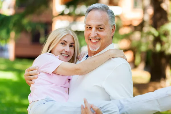 Mature couple walking in park — Stock Photo, Image