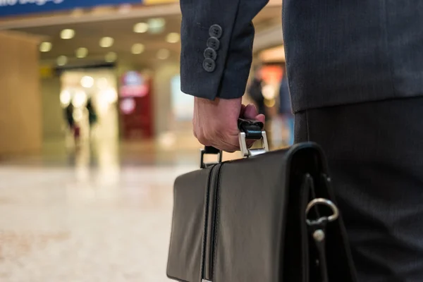 Commuter holding leather briefcase — Stock Photo, Image