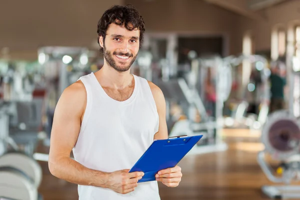 Personal trainer at gym — Stock Photo, Image