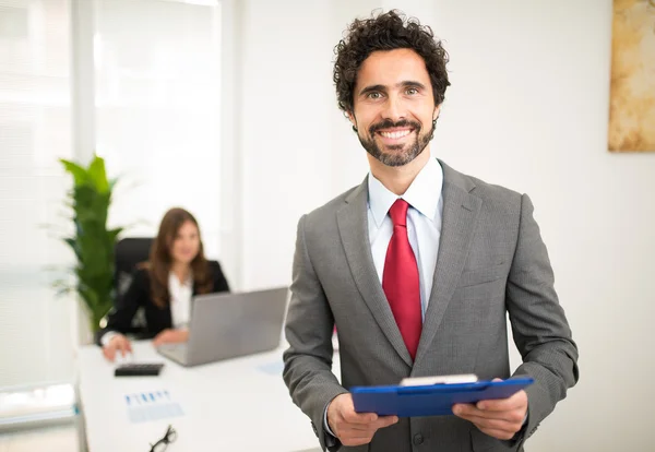Smiling businessman in office — Stock Photo, Image