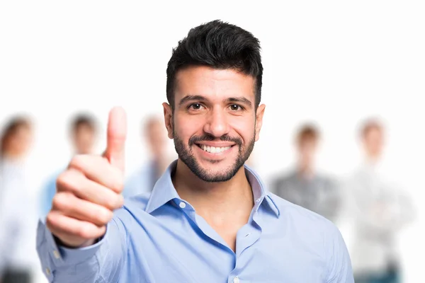 Smiling man giving thumbs up — Stock Photo, Image