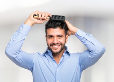 man combing his hair clipart