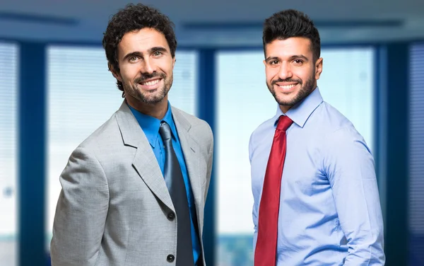 Businessmen in their office Royalty Free Stock Images