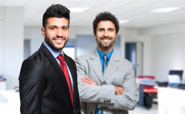 Businessmen in their office Stock Image